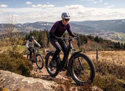 Man mountain biking on a CCM Nahanni Step through eBike All-terrain